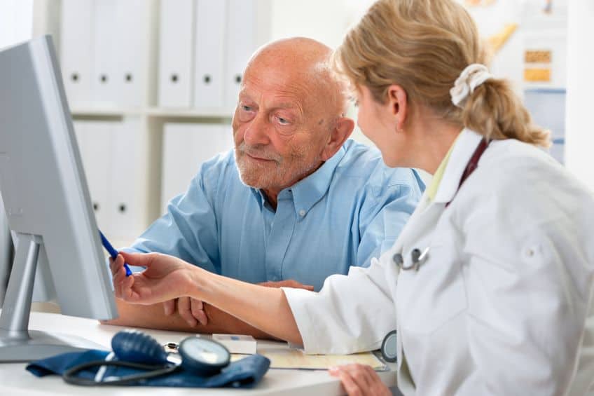 15472823 - doctor talking to her male senior patient at office